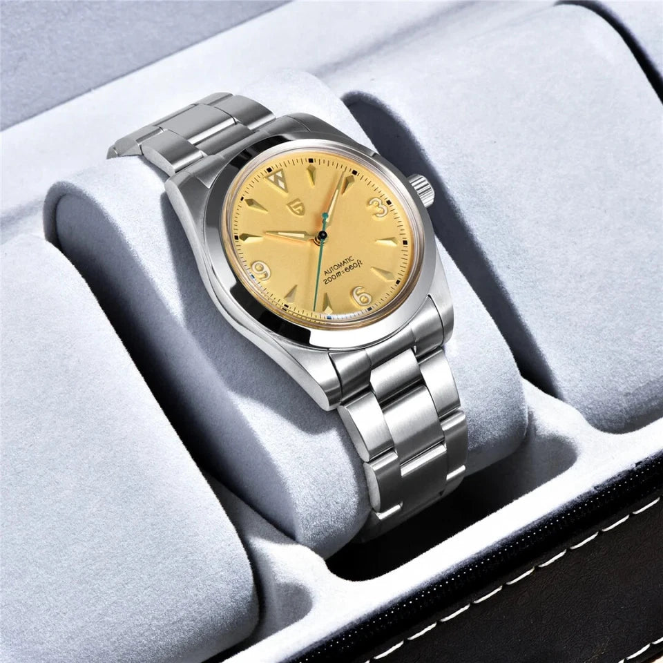 Silver watch with gold face on a gray cushion