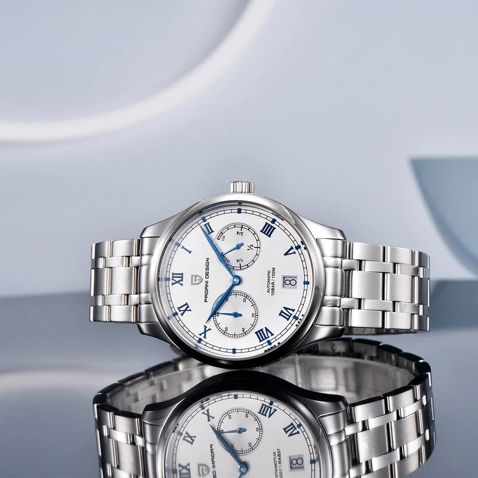 Silver watch with a reflective surface on a light blue background