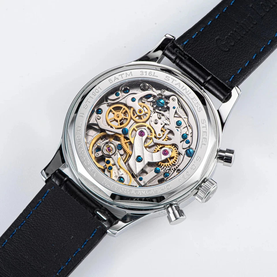 Mechanical watch with black leather strap on a white background