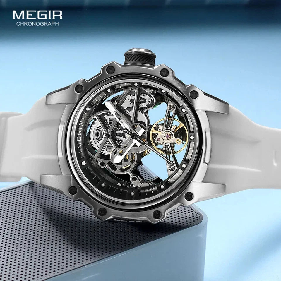 Mechanical watch with transparent case on a blue background, featuring the brand 'MEGIR'.
