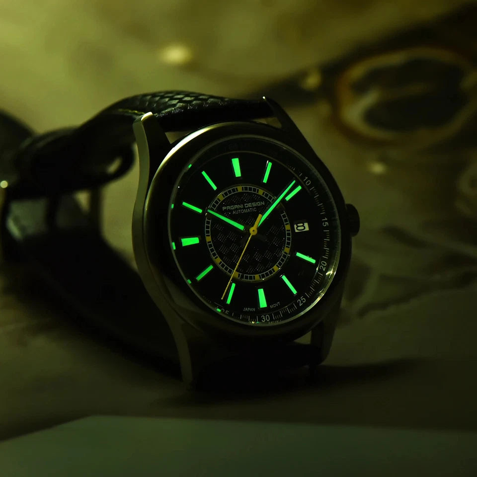 Watch with green glowing face on a dark background