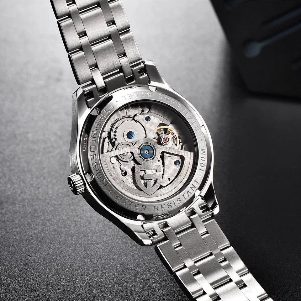 Close-up of a silver watch with visible mechanical components on a dark background