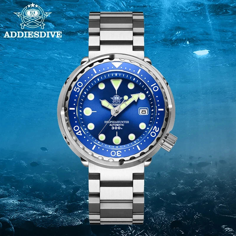 Diver's watch with blue dial and silver metal strap on a blue underwater background, featuring the Addiesdive brand.
