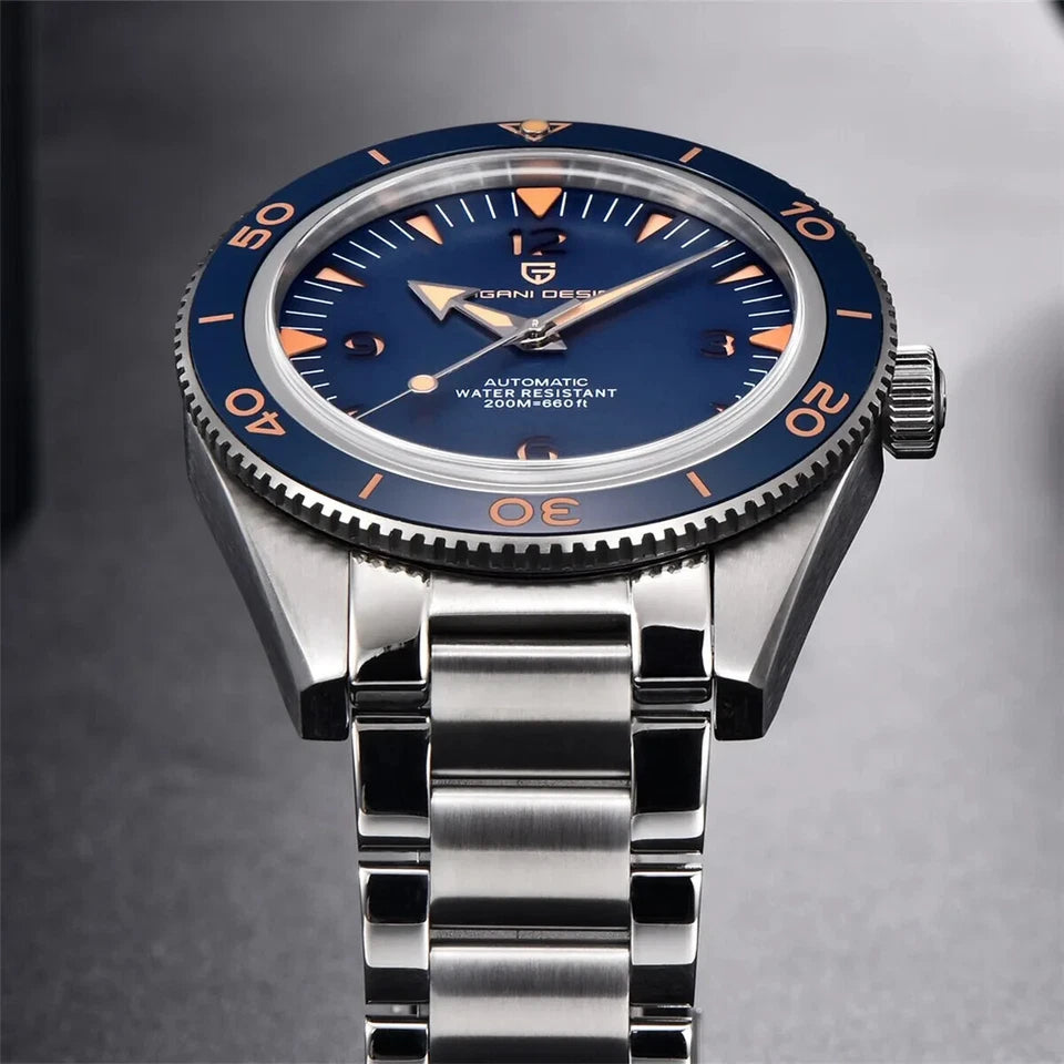 Watch with blue dial and silver bracelet on a gray background