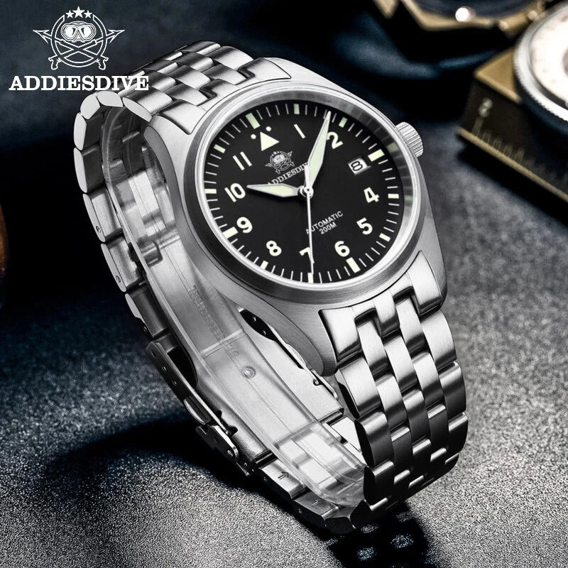 Silver wristwatch with black dial on a textured surface, featuring the ADDIESDIVE brand.