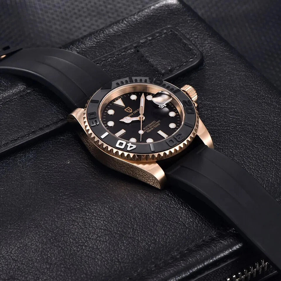 Black wristwatch with rose gold bezel on a black leather surface