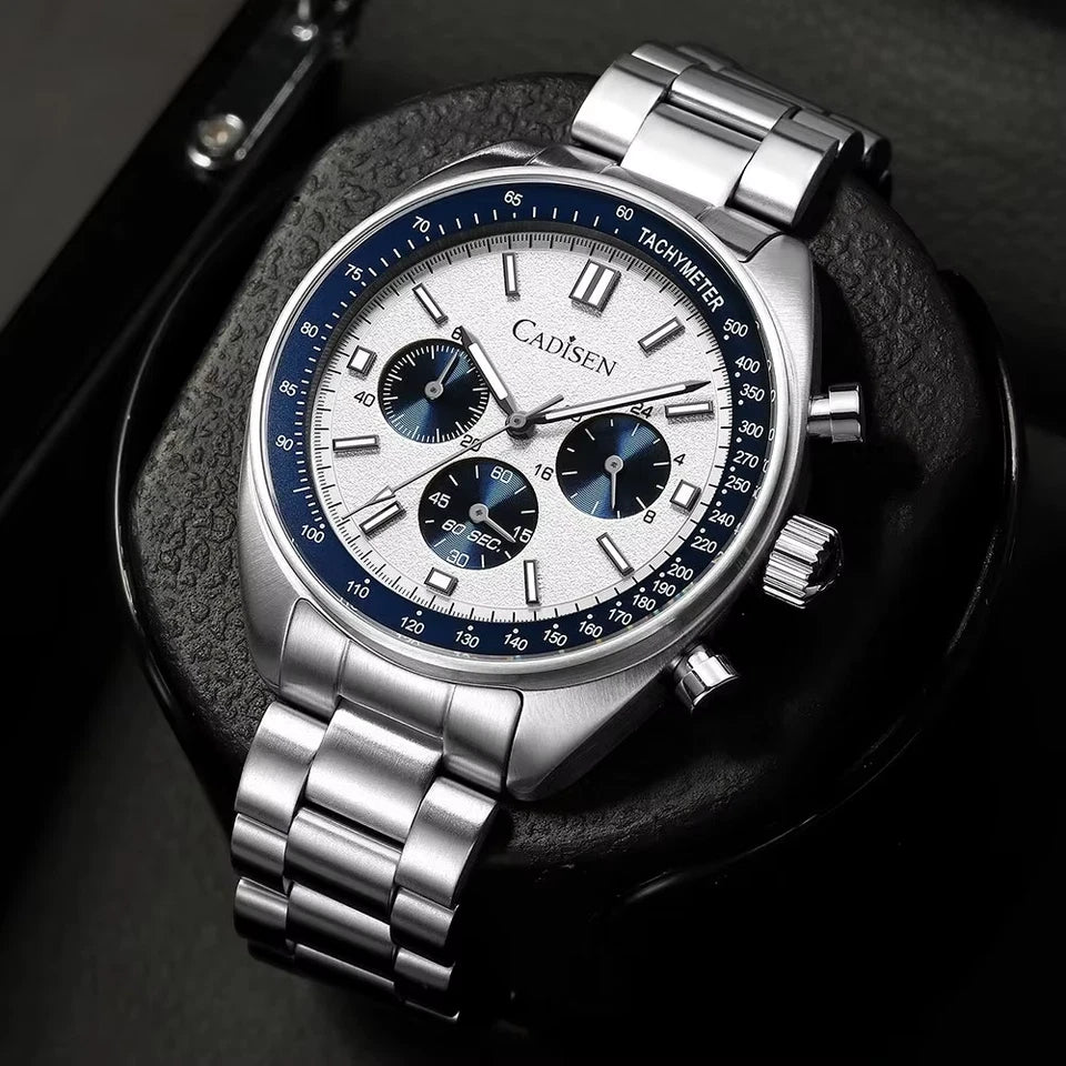 Silver wristwatch with a detailed face on a dark background