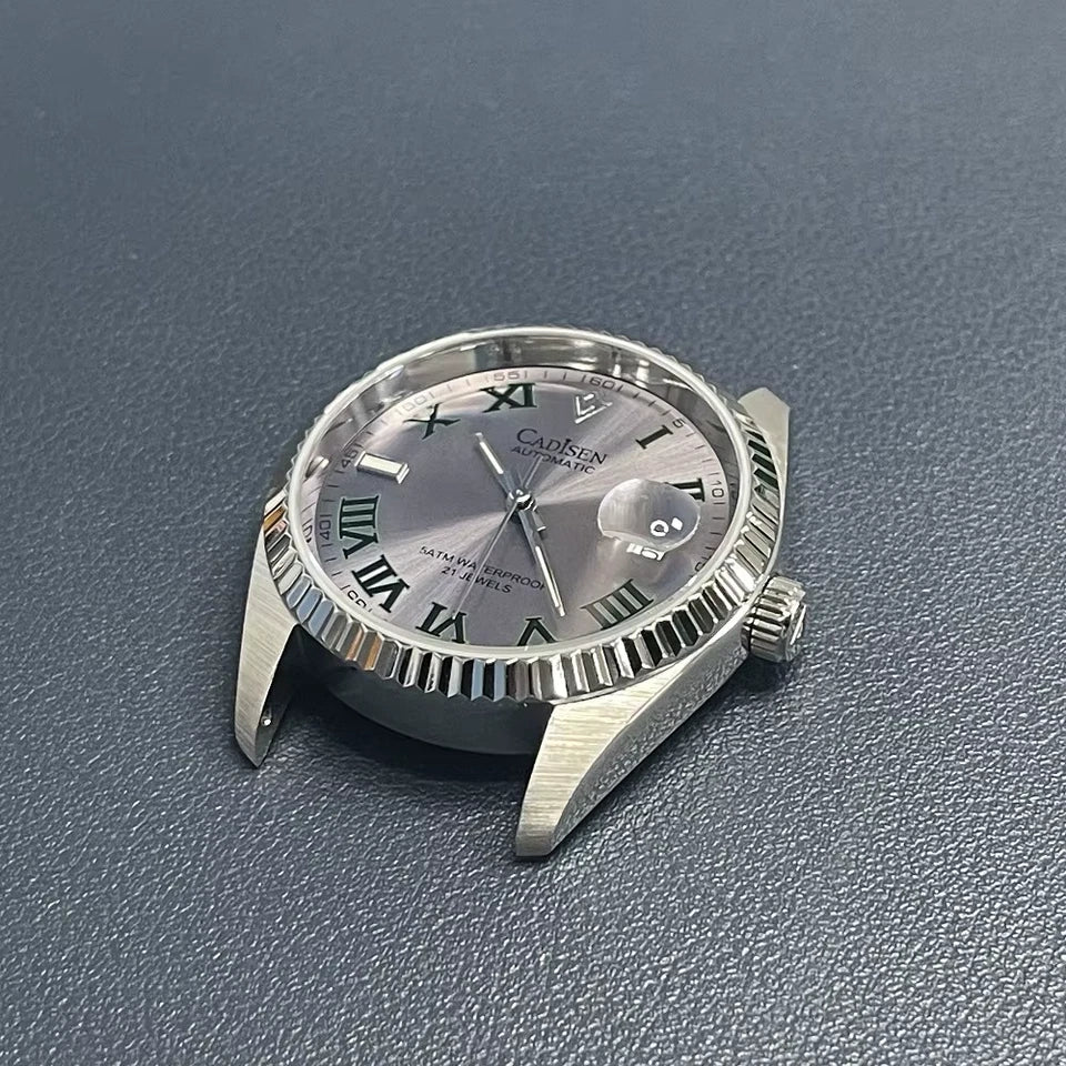 Silver wristwatch with a detailed face on a gray textured background