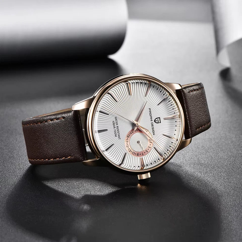 Luxury watch with brown leather strap and rose gold accents on a dark surface