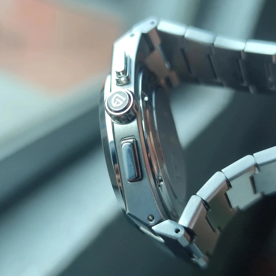 Close-up of a silver watch with a blurred background