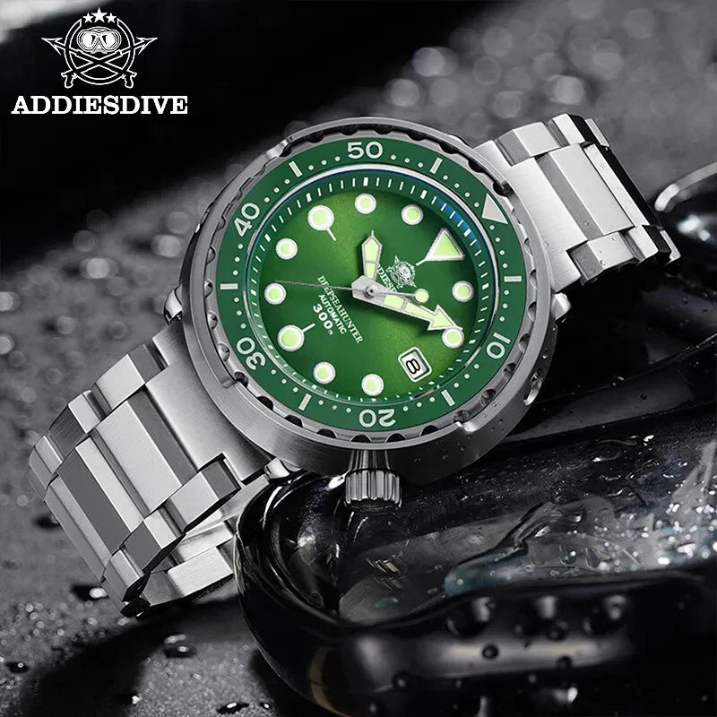 Green watch with silver metal strap on a dark textured background, featuring AddiesDive brand.