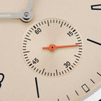 Close-up of Seestern S382 cream dial small-seconds subdial with orange hand and printed track