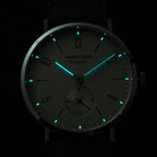 Seestern S382 dial glowing blue-green lume in the dark, applied hour markers and hands illuminated