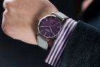 Seestern S382 purple dial dress watch on grey suede strap on the wrist with striped cuff, lifestyle