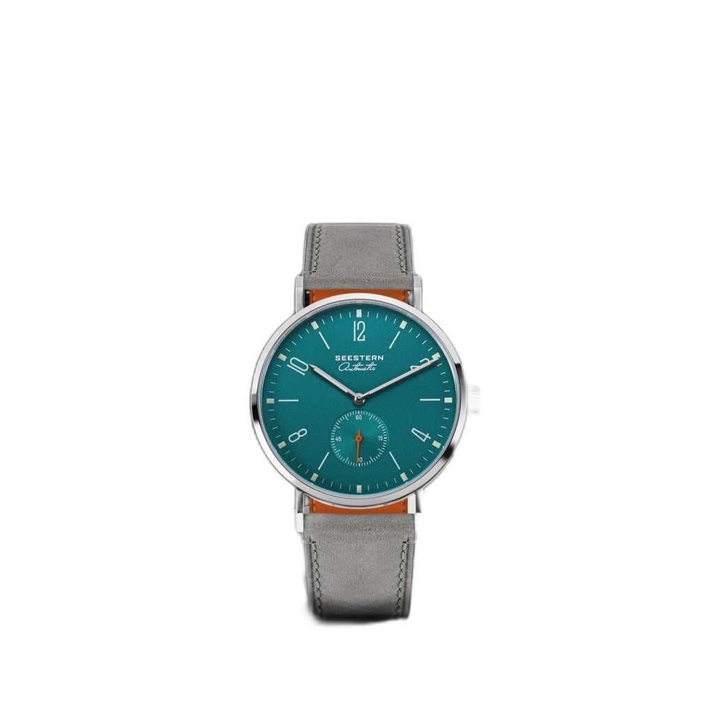 Seestern S382 turquoise dial watch centred on white, grey suede strap, plain product shot