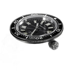 Seestern S404 watch head laid flat beside its detached screw-down crown, showing bezel knurling