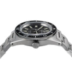 Seestern S404 diver side profile showing black dive bezel and star-engraved crown, steel bracelet