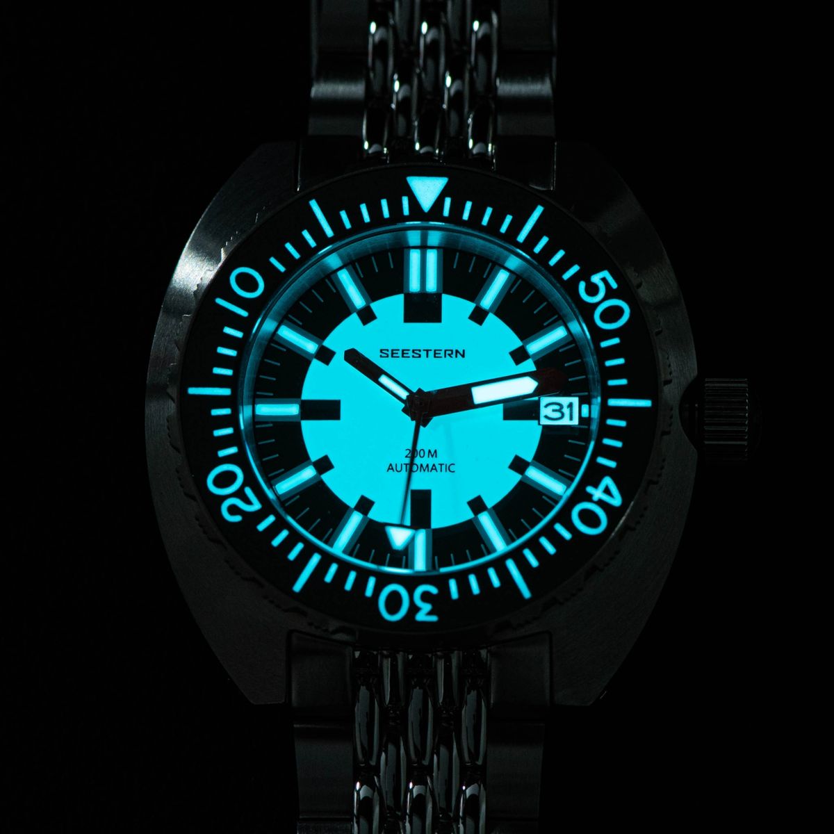 Seestern S406-2 Full Lume diver dial glowing bright blue lume in the dark, steel bracelet