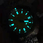 Seestern S406 diver dial glowing blue-green lume in the dark, applied markers illuminated