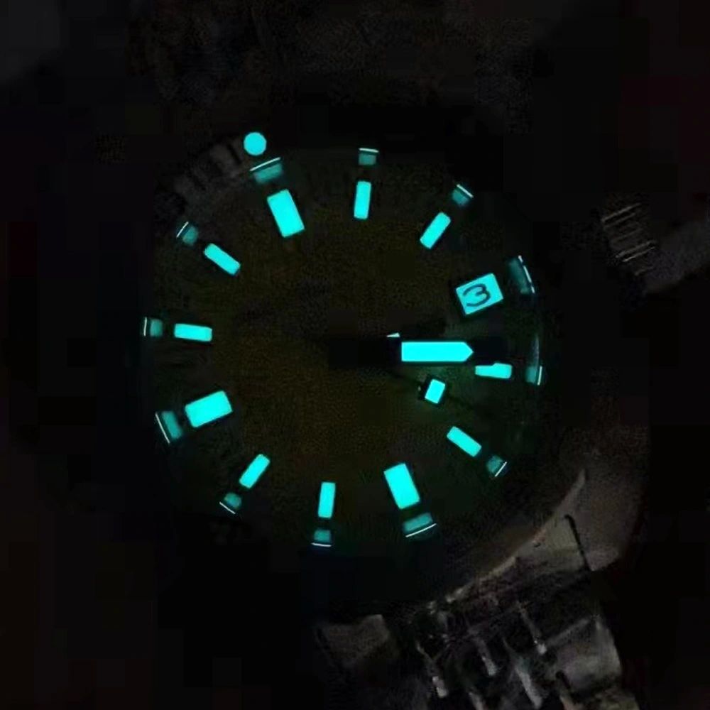 Seestern S406 diver dial glowing blue-green lume in the dark, applied markers illuminated