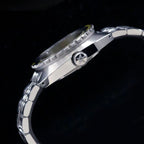 Seestern S406 case side profile with the signed crown, shot against a dark background