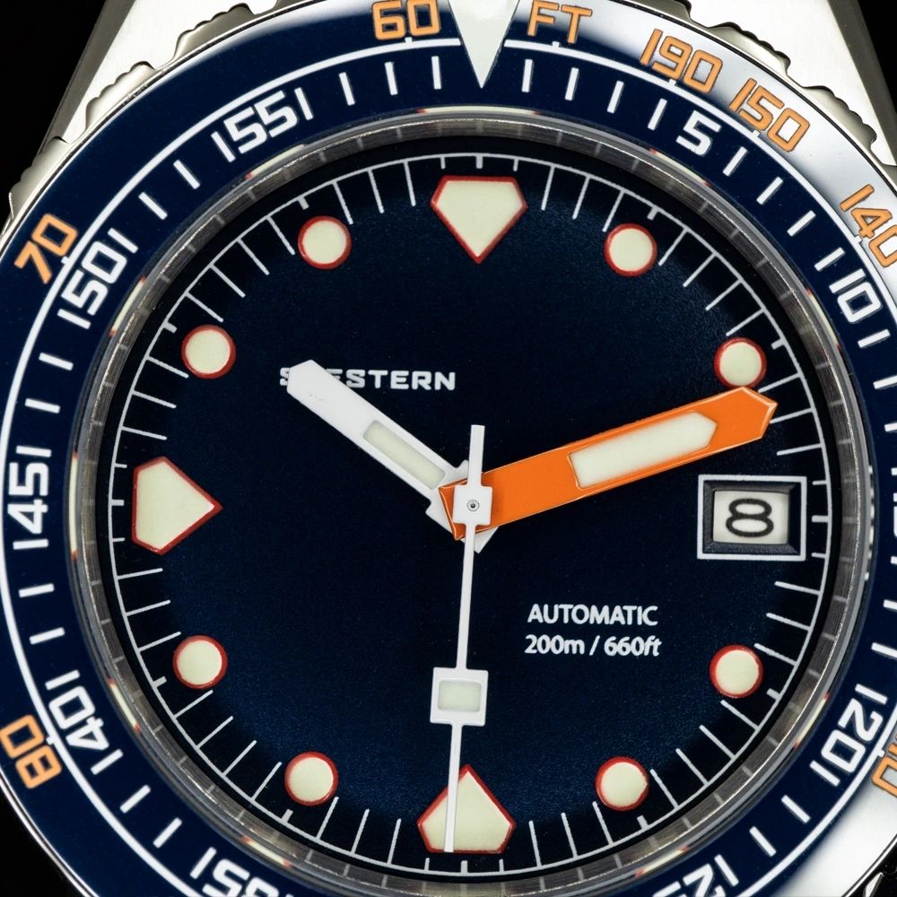 Seestern S407 dark blue dial macro showing SEESTERN print, orange hand and date window