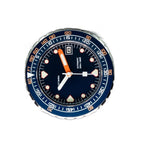 Seestern S407 dark blue dial close-up with orange sword hand, applied lume markers and date