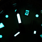 Seestern S407 tiffany blue diver dial glowing blue lume in the dark, date at 3, close-up