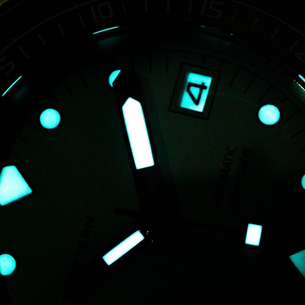 Seestern S407 tiffany blue diver dial glowing blue lume in the dark, date at 3, close-up