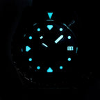 Seestern S407 diver dial glowing blue-green lume in the dark, applied markers illuminated