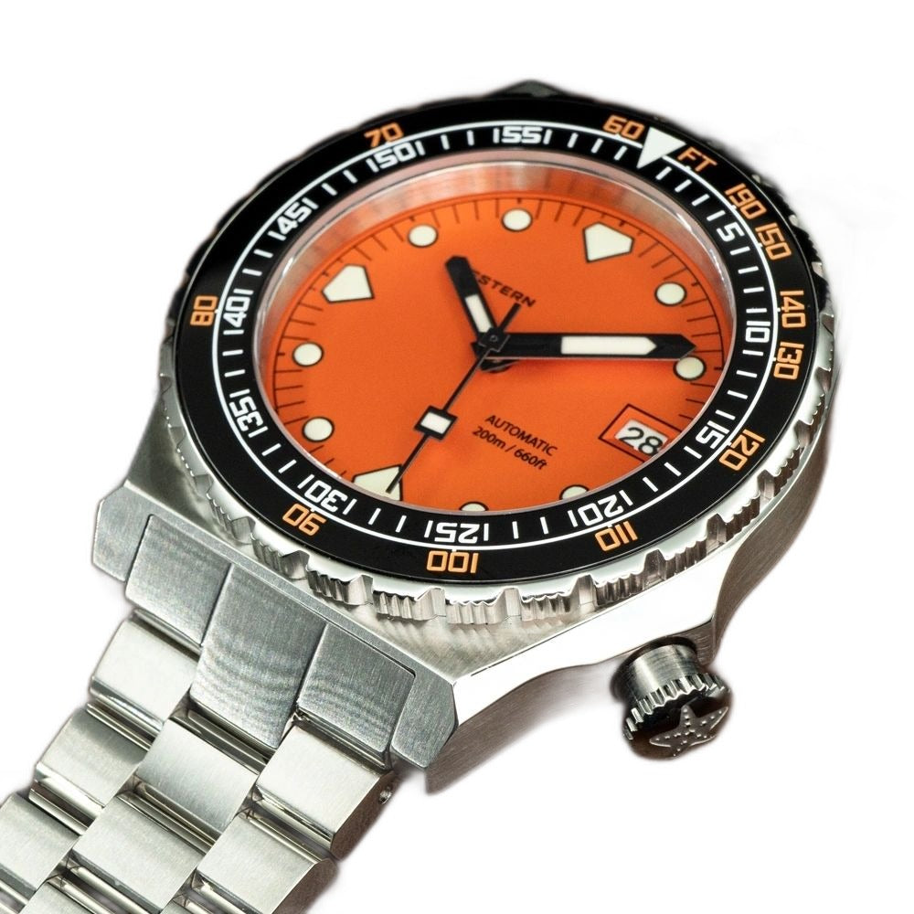 Seestern S407 orange ceramic diver on steel bracelet, angled view on brown leather