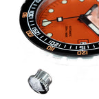 Seestern S407 screw-down crown macro with star logo, orange dial and black bezel cropped behind