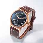Seestern S408 bronze pilot, black textured dial and brown leather strap, dramatic angled studio view