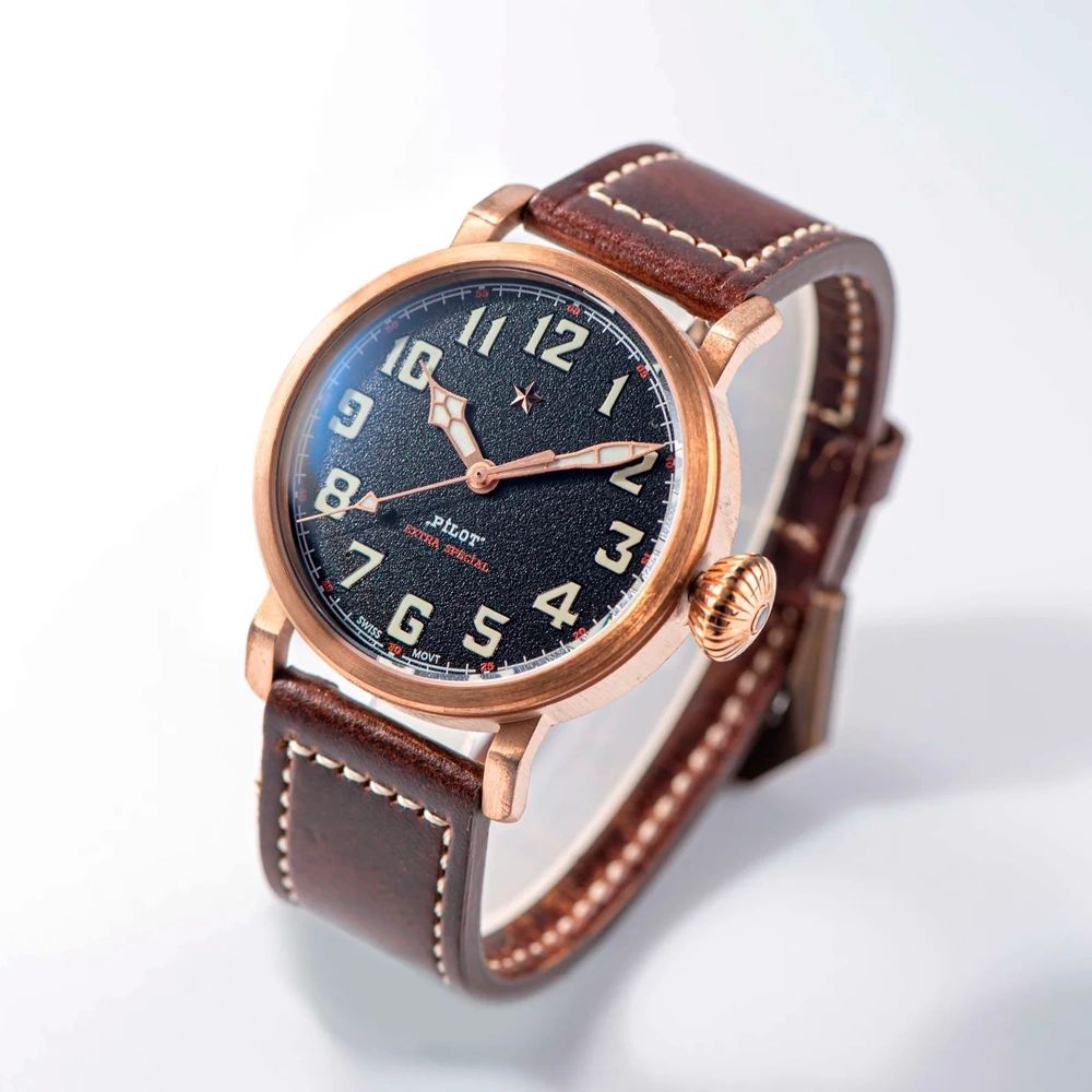 Seestern S408 bronze pilot, black textured dial and brown leather strap, dramatic angled studio view