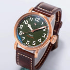 Seestern S408 bronze pilot, green textured dial and brown leather strap, dramatic angled studio view