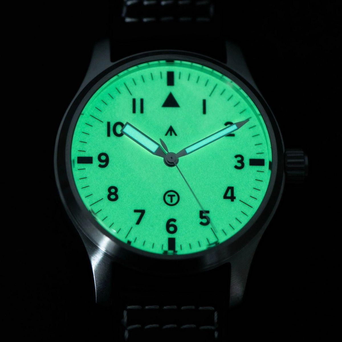 Seestern S424 flieger dial glowing bright green full lume in the dark, triangle and numerals illuminated