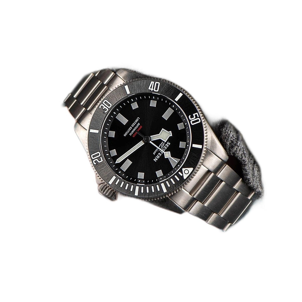 Seestern S430 black dial titanium diver angled on white with steel bracelet