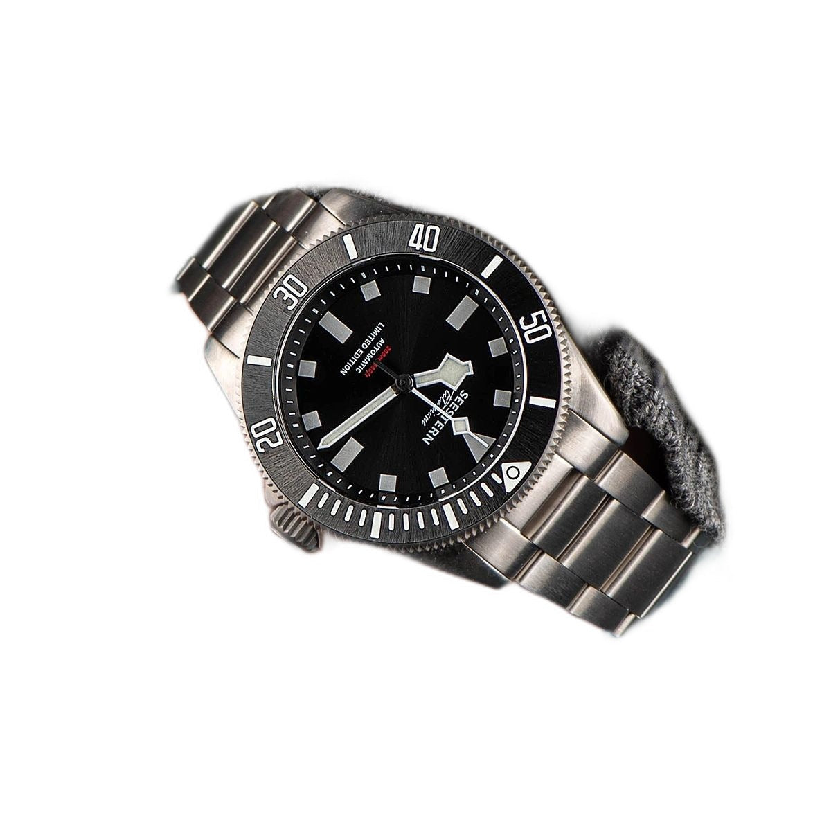 Seestern S430 black dial titanium diver angled on white with steel bracelet