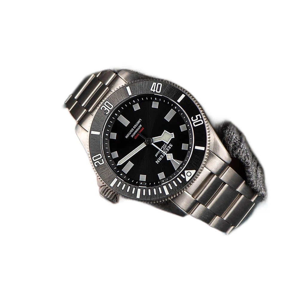 Seestern S430 black-dial titanium diver worn on wrist with titanium bracelet, close-up