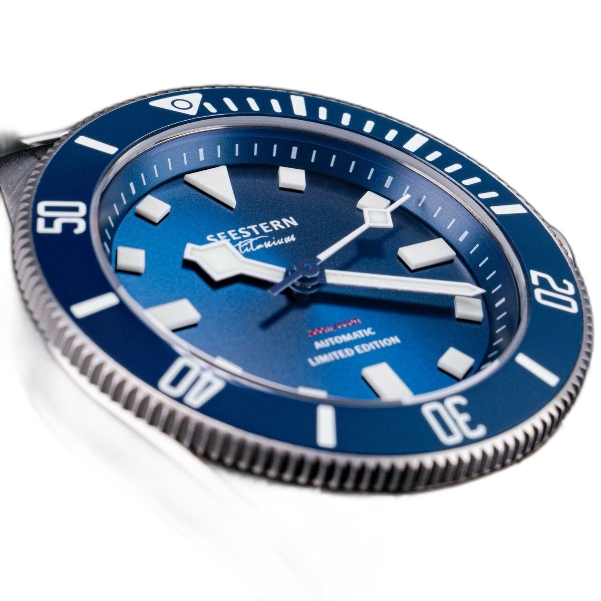 Seestern S430 blue-dial titanium diver close-up showing lume markers, sword hands and clean dial