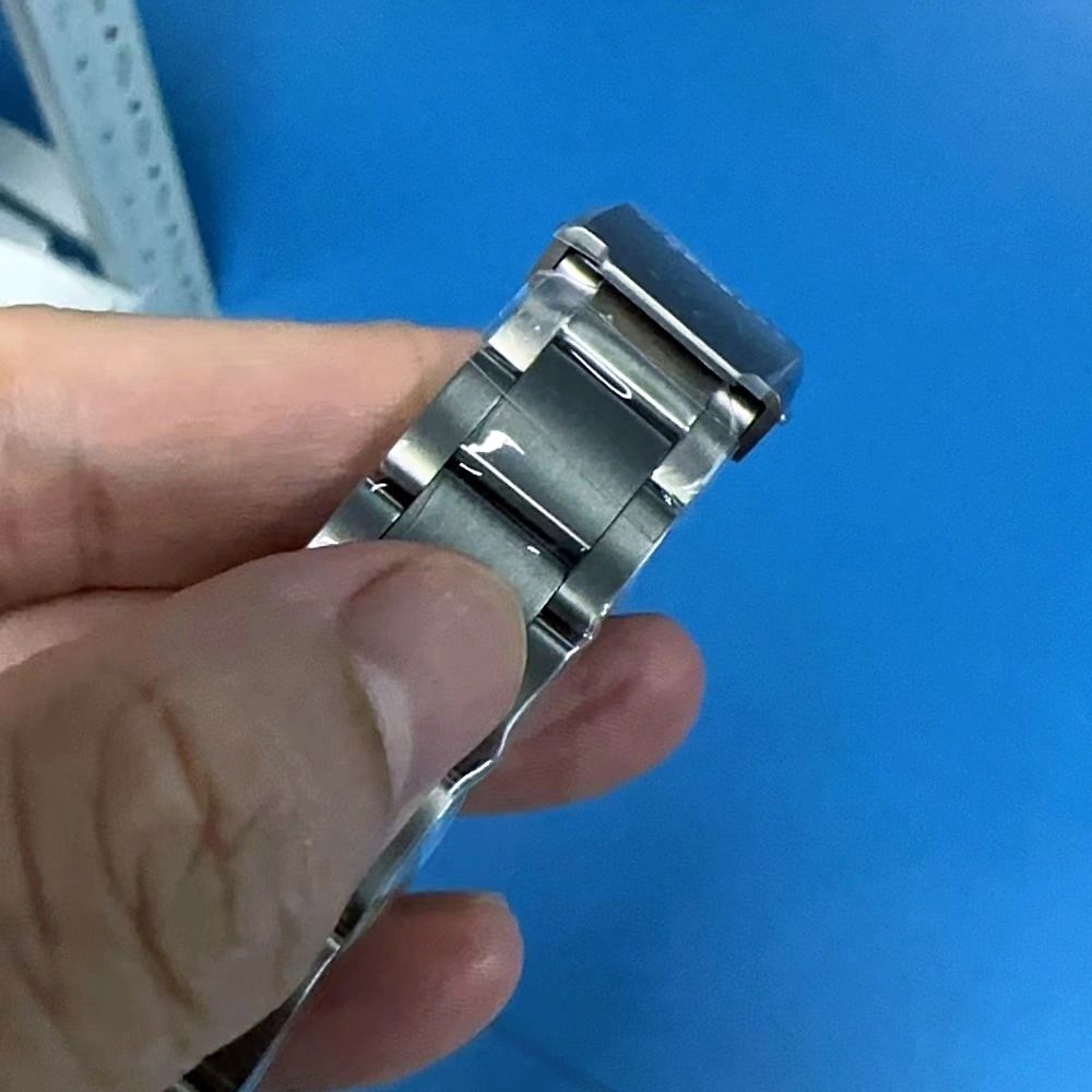 Seestern S430 titanium bracelet and folding clasp held in hand, brushed links close-up
