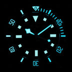Seestern S430 diver dial glowing blue-green lume in the dark, markers and dive bezel illuminated