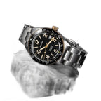 Seestern S434-2 black-and-gold skin diver on steel bracelet, dramatic angled reflection view