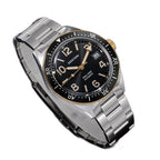 Seestern S434-2 black-and-gold skin diver, gold bezel and hands, steel bracelet, angled view