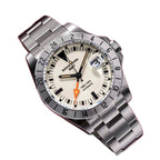 Seestern S436-2 cream-dial vintage GMT on steel bracelet, angled view on deep red background