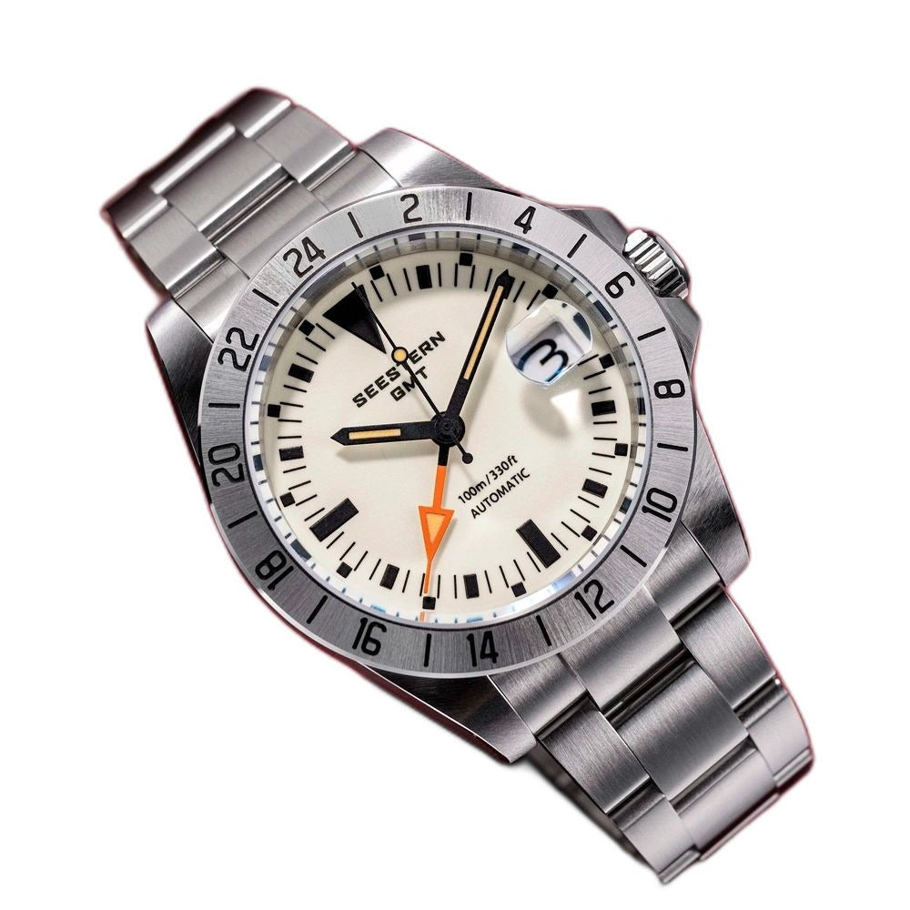 Seestern S436-2 cream-dial vintage GMT on steel bracelet, angled view on deep red background