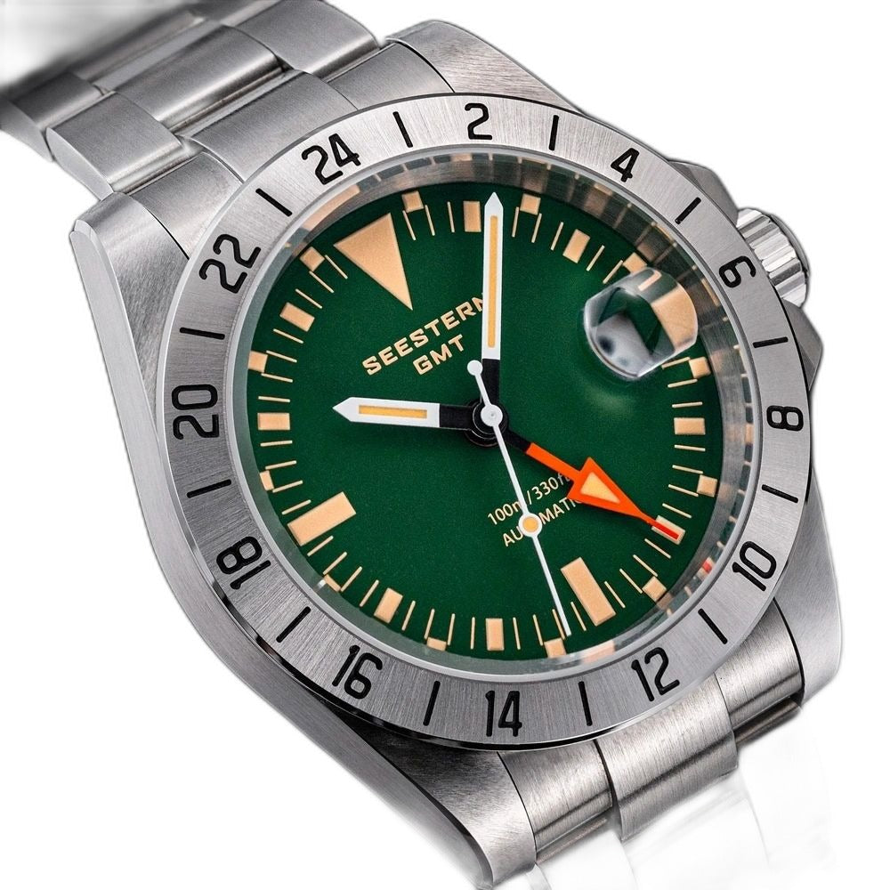 Seestern S436-2 green dial close-up with orange GMT hand, lume markers and cyclops date window