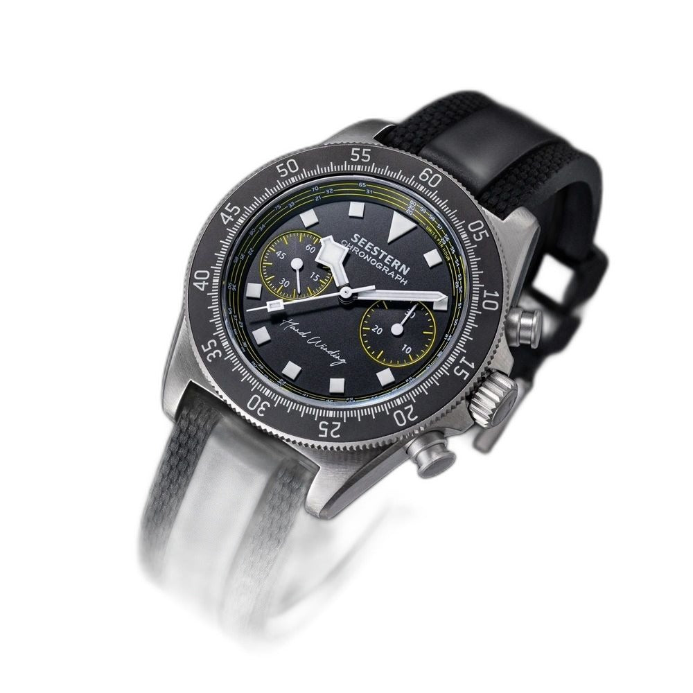 Seestern S443 hand-winding chronograph, black dial with yellow accents, tachymeter bezel, black strap, angled view
