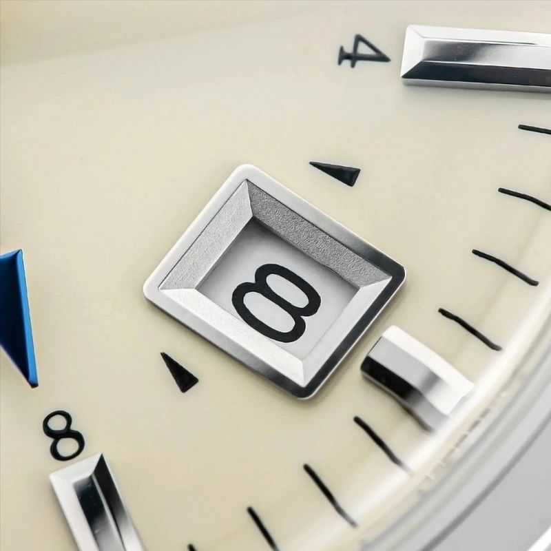 Seestern S446 cream dial date window at 3 close-up with applied markers and blue GMT hand tip