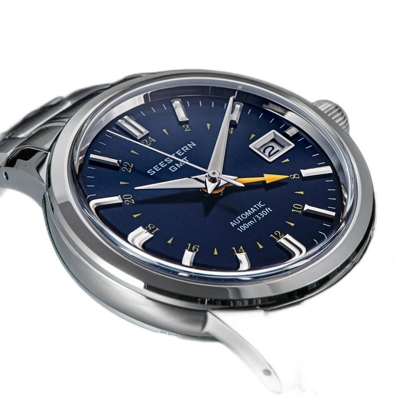 Seestern S446 navy blue-dial GMT on steel bracelet, three-quarter angled view